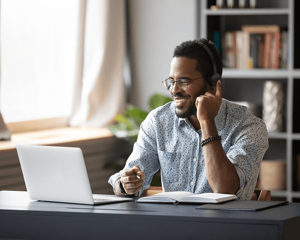 Remote Professional Working with Headset and Laptop